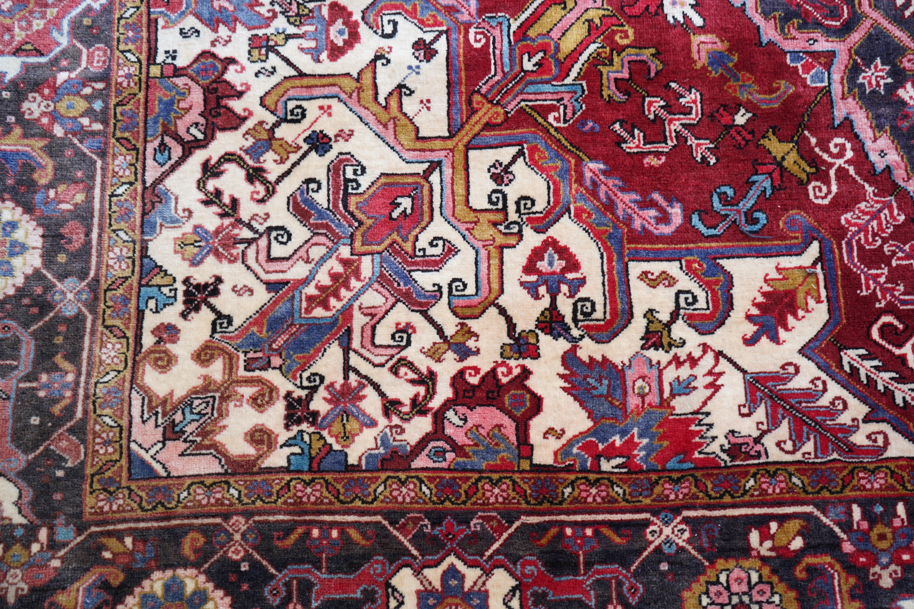 A Heriz red ground carpet